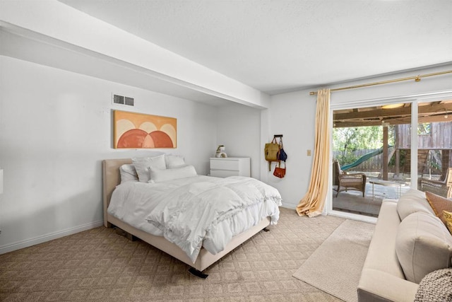 bedroom with visible vents, access to exterior, light colored carpet, and baseboards