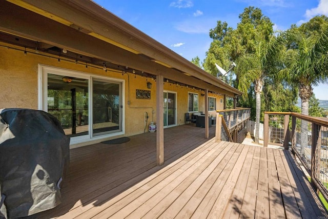 deck featuring a grill