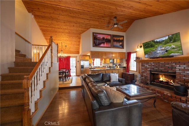 living area featuring high vaulted ceiling, dark wood-type flooring, stairs, and wooden ceiling
