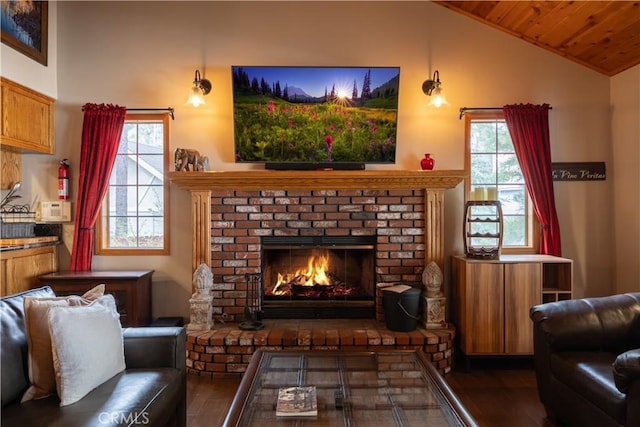 sitting room featuring wood ceiling, lofted ceiling, a brick fireplace, and wood finished floors