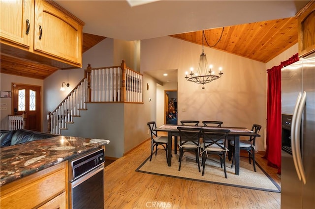 kitchen featuring light wood-style flooring, stainless steel fridge, a notable chandelier, lofted ceiling, and wood ceiling