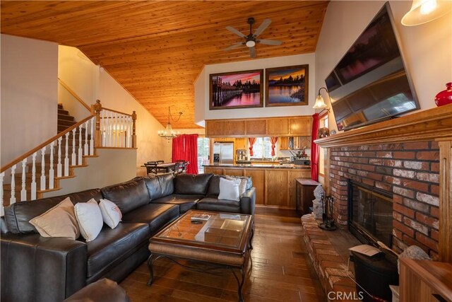 living area with stairway, wood ceiling, ceiling fan, a fireplace, and dark wood-style flooring