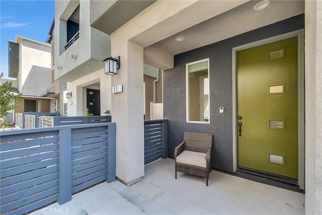 view of exterior entry with stucco siding