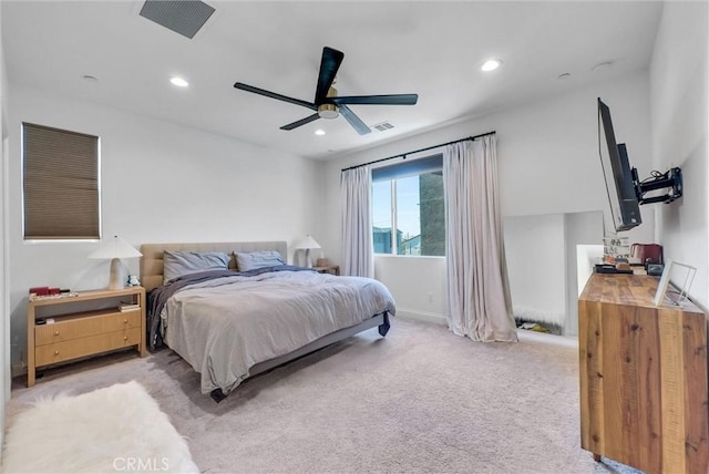 bedroom featuring light carpet, a ceiling fan, visible vents, and recessed lighting