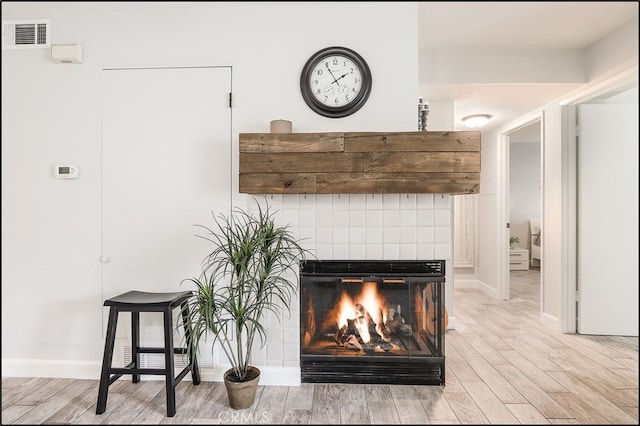 3 Hillrose, Aliso Viejo, CA 92656 - room details with visible vents, baseboards, wood finished floors, and a fireplace