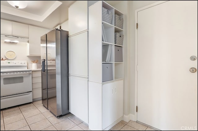 3 Hillrose, Aliso Viejo, CA 92656 - kitchen featuring stainless steel fridge, light countertops, light tile patterned floors, under cabinet range hood, and white electric range