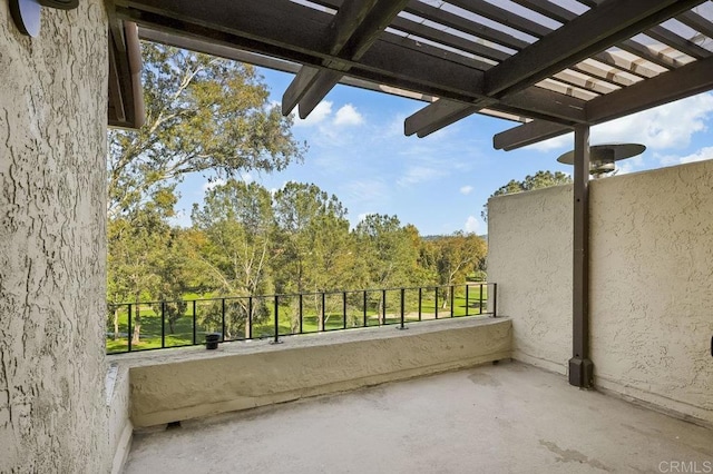 balcony featuring a pergola