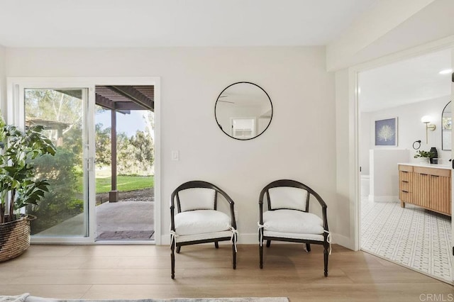 sitting room featuring wood finished floors and baseboards