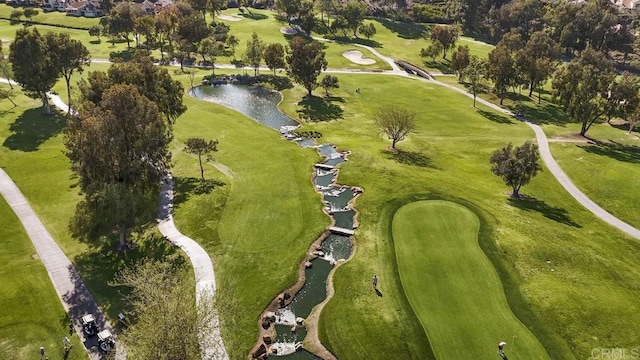 aerial view featuring a water view and view of golf course