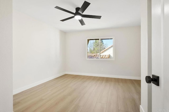 unfurnished room with light wood-style flooring, ceiling fan, and baseboards