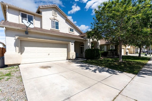 view of front of home featuring a garage, a front yard, stucco siding, and concrete driveway