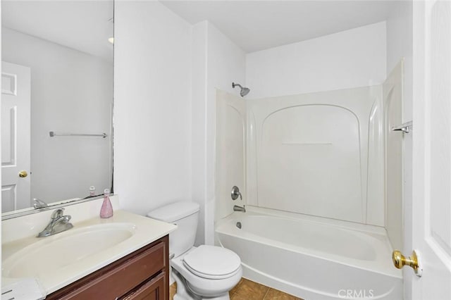 bathroom featuring tile patterned flooring, vanity, bathtub / shower combination, and toilet
