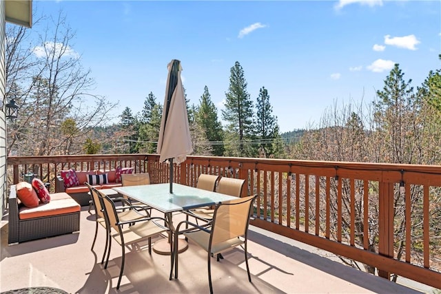 wooden deck featuring an outdoor hangout area and outdoor dining area
