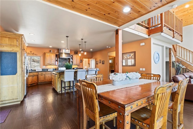 dining room featuring recessed lighting, wooden ceiling, and dark wood finished floors