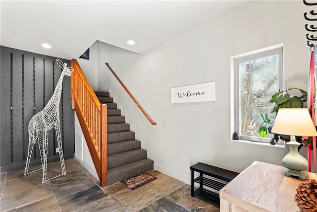 stairs featuring baseboards and recessed lighting