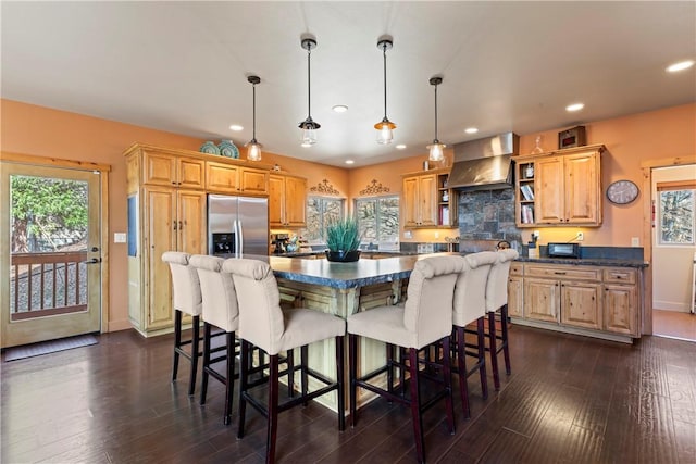 756 Brentwood Dr, Lake Arrowhead, CA 92352 - kitchen with wall chimney exhaust hood, stainless steel refrigerator with ice dispenser, dark countertops, open shelves, and recessed lighting