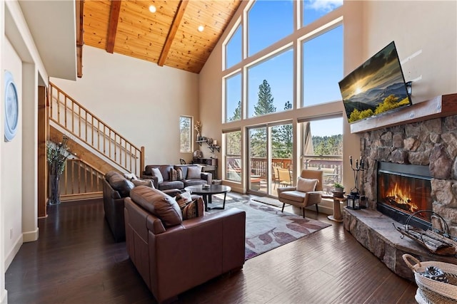 756 Brentwood Dr, Lake Arrowhead, CA 92352 - living room featuring high vaulted ceiling, stairway, wood-type flooring, a stone fireplace, and a wooden ceiling with exposed beams