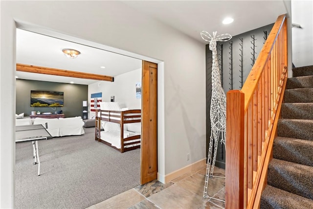 stairway featuring carpet floors, baseboards, beam ceiling, and recessed lighting