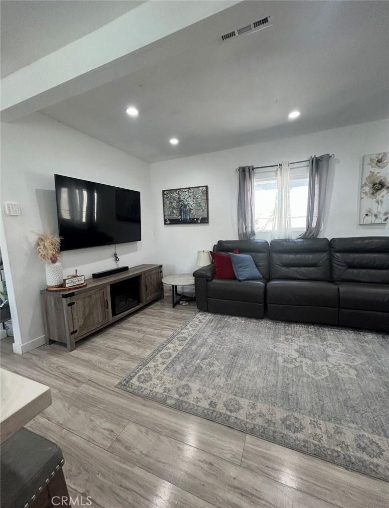 1715ST W 155th, Compton, CA 90220 - living area featuring light wood finished floors and recessed lighting