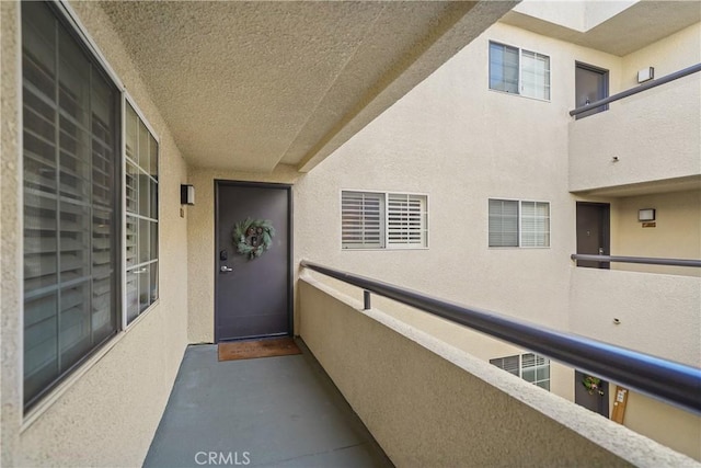 view of exterior entry featuring stucco siding
