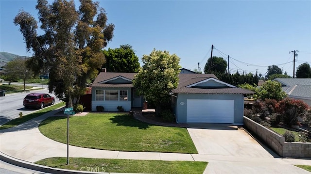 ranch-style house featuring concrete driveway, a front yard, and stucco siding