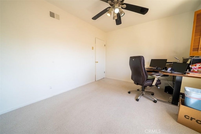 carpeted home office featuring visible vents and a ceiling fan