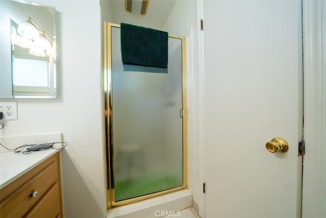 full bathroom featuring a shower stall and vanity
