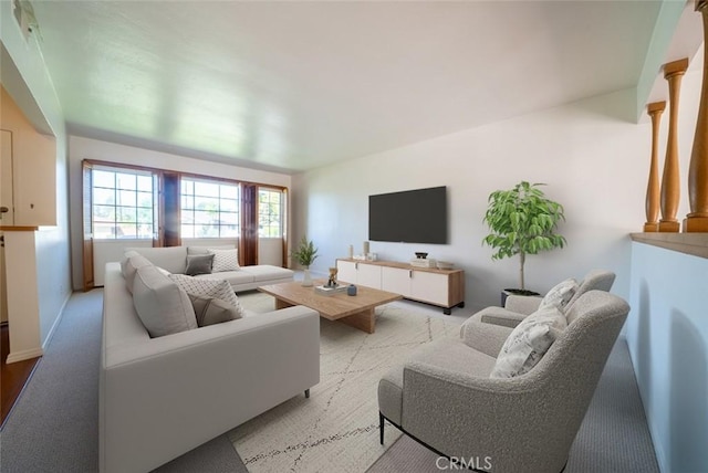living area featuring baseboards