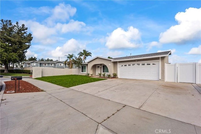 10806 Bayonne Dr, Riverside, CA 92505 - ranch-style house with an attached garage, concrete driveway, a front lawn, stucco siding, and a gate