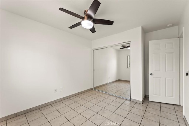 10806 Bayonne Dr, Riverside, CA 92505 - unfurnished bedroom with a closet, light tile patterned floors, baseboards, and a ceiling fan