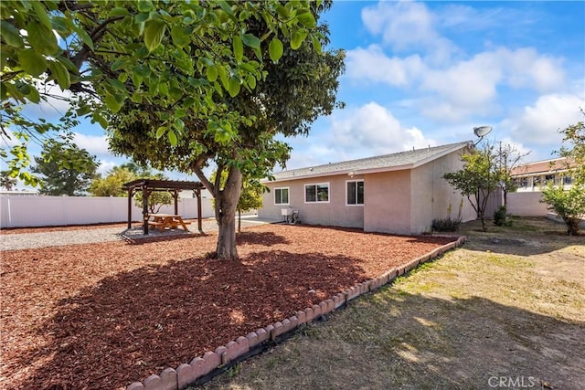 10806 Bayonne Dr, Riverside, CA 92505 - back of house with a patio, stucco siding, and a fenced backyard