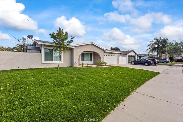 10806 Bayonne Dr, Riverside, CA 92505 - ranch-style home with driveway, stucco siding, an attached garage, and a front lawn