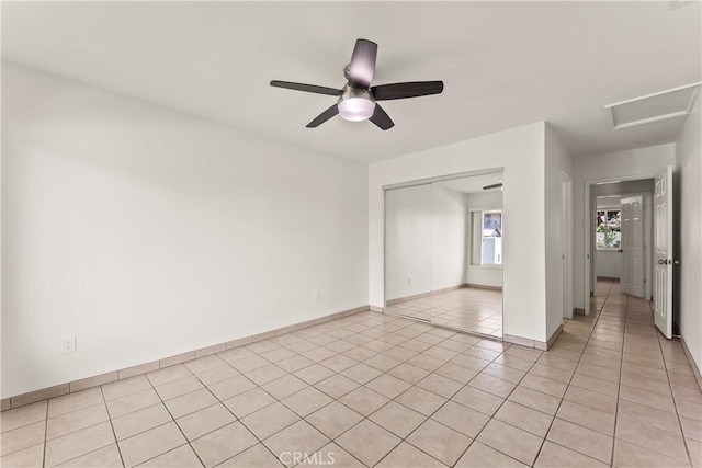 10806 Bayonne Dr, Riverside, CA 92505 - unfurnished bedroom featuring a closet, light tile patterned floors, baseboards, ceiling fan, and attic access