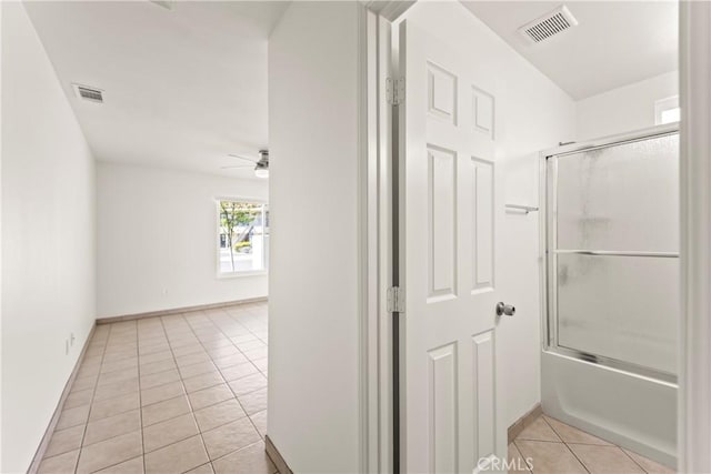 10806 Bayonne Dr, Riverside, CA 92505 - full bath featuring combined bath / shower with glass door, tile patterned flooring, visible vents, and ceiling fan