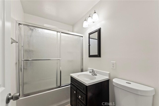 10806 Bayonne Dr, Riverside, CA 92505 - bathroom featuring toilet, enclosed tub / shower combo, and vanity