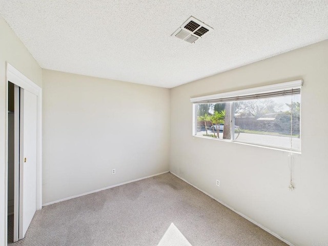 837 Oneonta St, Imperial Beach, CA 91932 - unfurnished bedroom with visible vents, baseboards, carpet flooring, and a textured ceiling