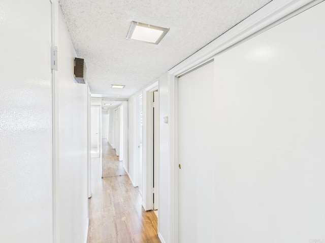 837 Oneonta St, Imperial Beach, CA 91932 - corridor featuring light wood-style flooring and a textured ceiling