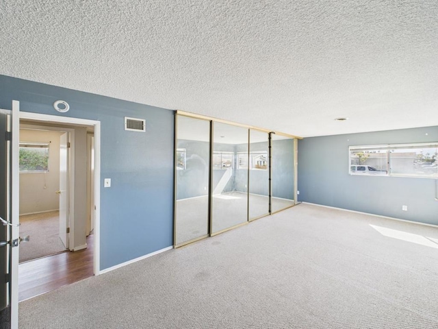 837 Oneonta St, Imperial Beach, CA 91932 - unfurnished bedroom featuring a textured ceiling, carpet flooring, baseboards, and visible vents