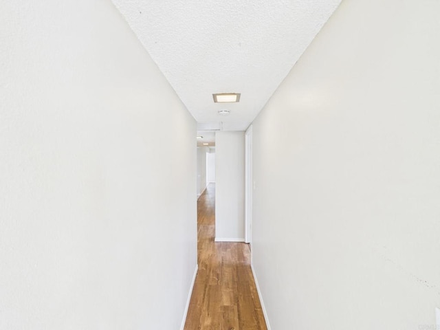 837 Oneonta St, Imperial Beach, CA 91932 - hall with a textured ceiling, wood finished floors, and baseboards