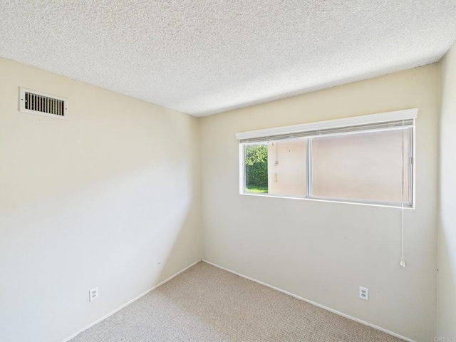 837 Oneonta St, Imperial Beach, CA 91932 - empty room featuring visible vents, baseboards, carpet flooring, and a textured ceiling