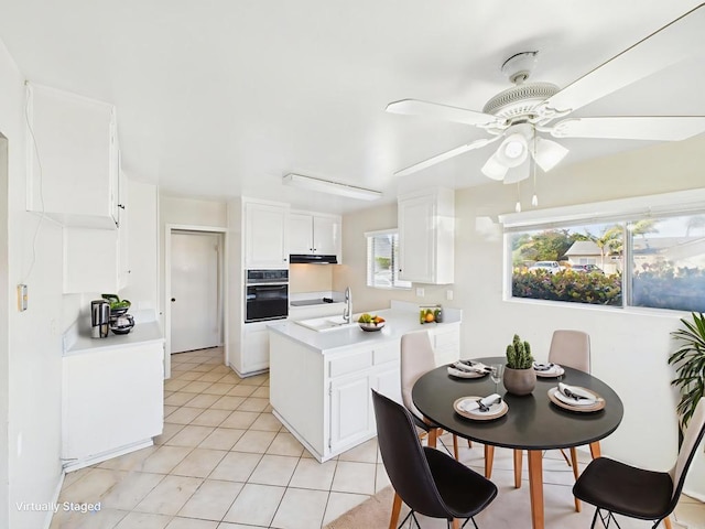 837 Oneonta St, Imperial Beach, CA 91932 - kitchen featuring wall oven, ceiling fan, light countertops, white cabinetry, and a peninsula