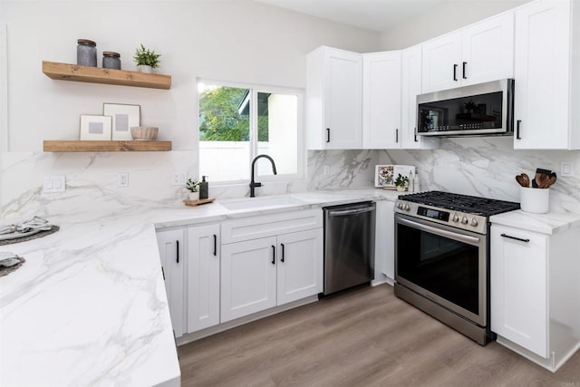 475 Parkwood Ln, Encinitas, CA 92024 - kitchen with appliances with stainless steel finishes, open shelves, decorative backsplash, and white cabinets