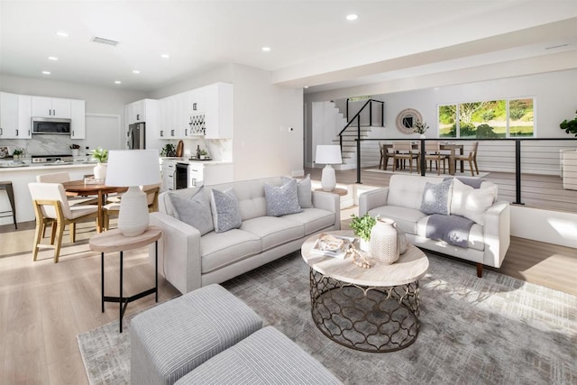 475 Parkwood Ln, Encinitas, CA 92024 - living room featuring light wood-style floors, stairs, and recessed lighting