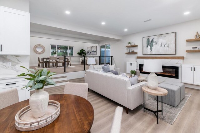 475 Parkwood Ln, Encinitas, CA 92024 - living area with light wood-type flooring, recessed lighting, and a premium fireplace
