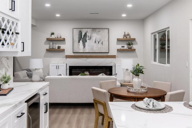 475 Parkwood Ln, Encinitas, CA 92024 - dining space with beverage cooler, light wood finished floors, recessed lighting, and a premium fireplace
