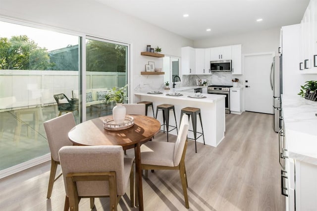 475 Parkwood Ln, Encinitas, CA 92024 - dining room with light wood finished floors and recessed lighting