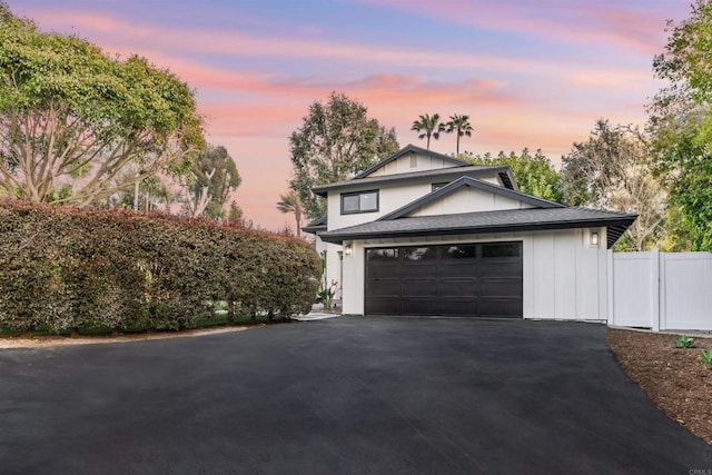 475 Parkwood Ln, Encinitas, CA 92024 - view of front facade featuring driveway, a garage, and board and batten siding