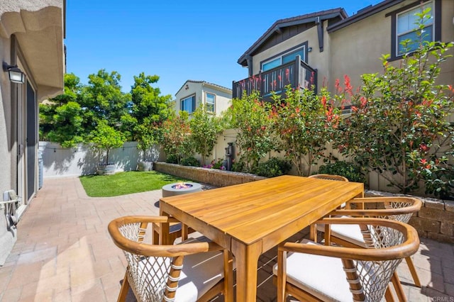 view of patio featuring a fenced backyard and outdoor dining area