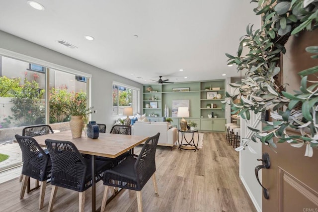dining area with light wood finished floors, visible vents, recessed lighting, and a ceiling fan