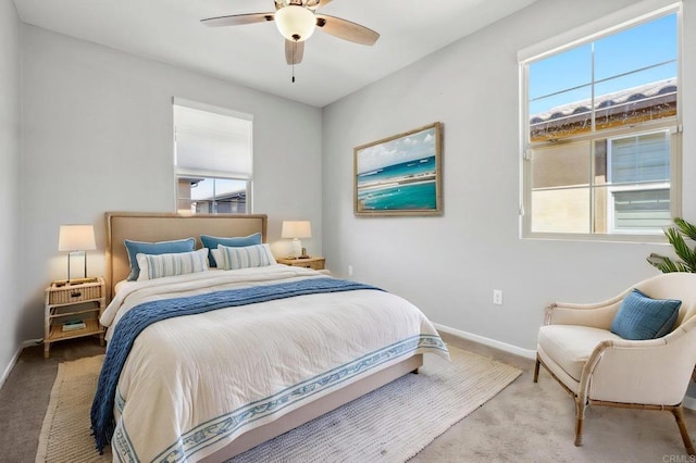 bedroom featuring ceiling fan, baseboards, and carpet floors